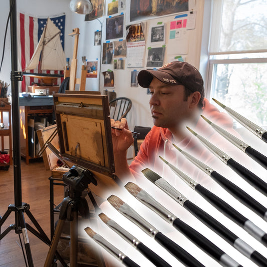 a main sitting behind a row of paintbrushes