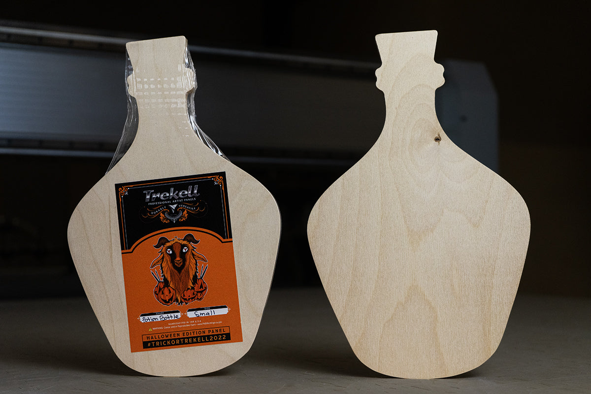 two wood canvases in the shape of bottles with a label that says 'trekell' on it