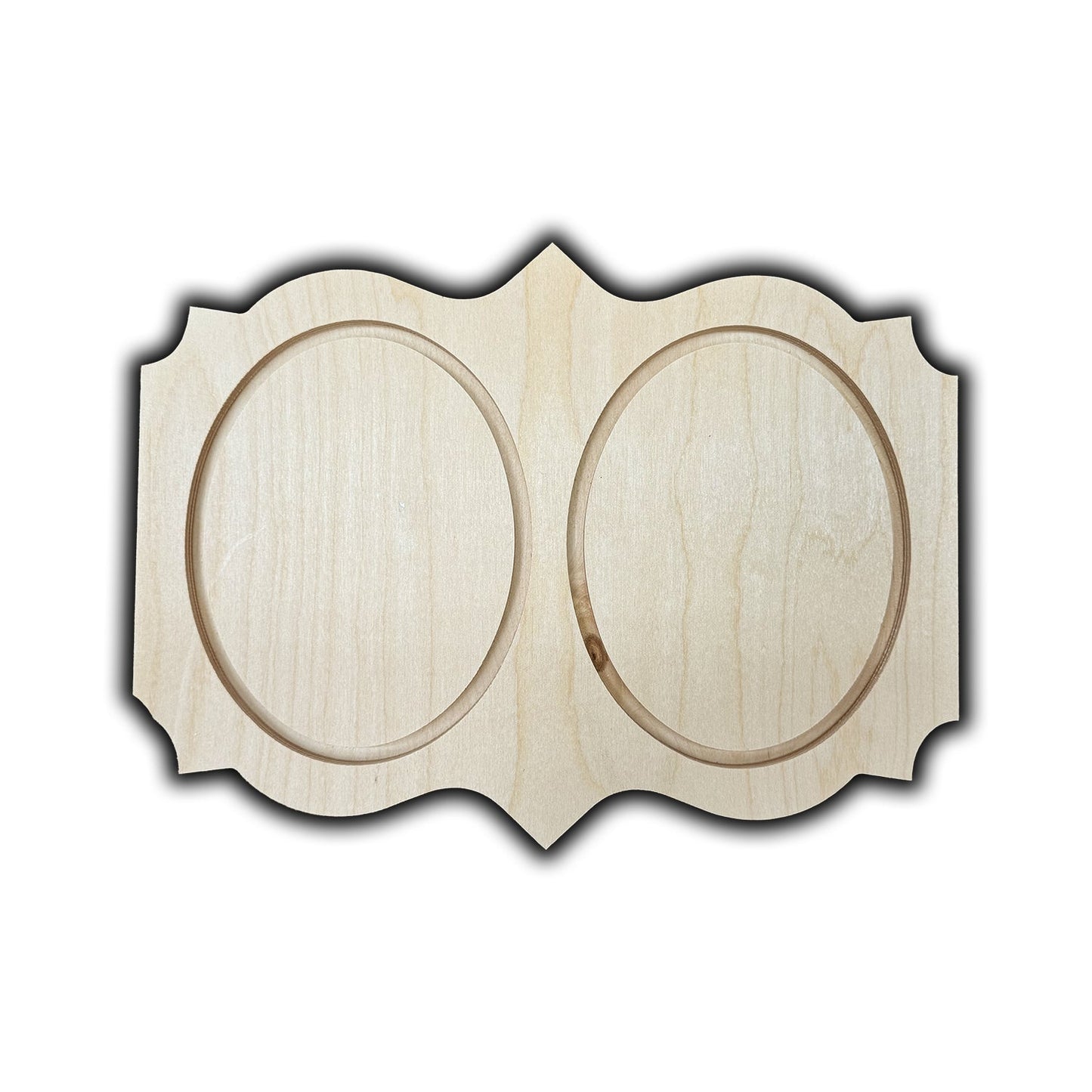 a wooden plaque with two circles carved into it